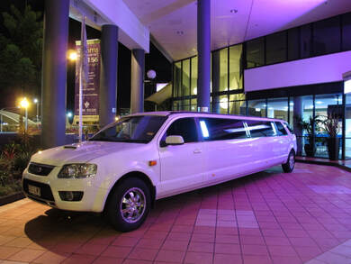 super stretch white limousine picture with ocean in the background