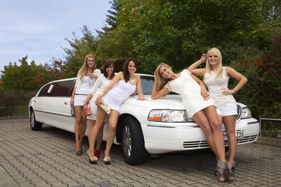girls aoround gorgeous white limo for hire.